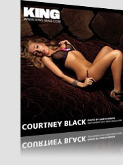 Courtney Black King Magazine cover laying on bed wearing see-thru black bra