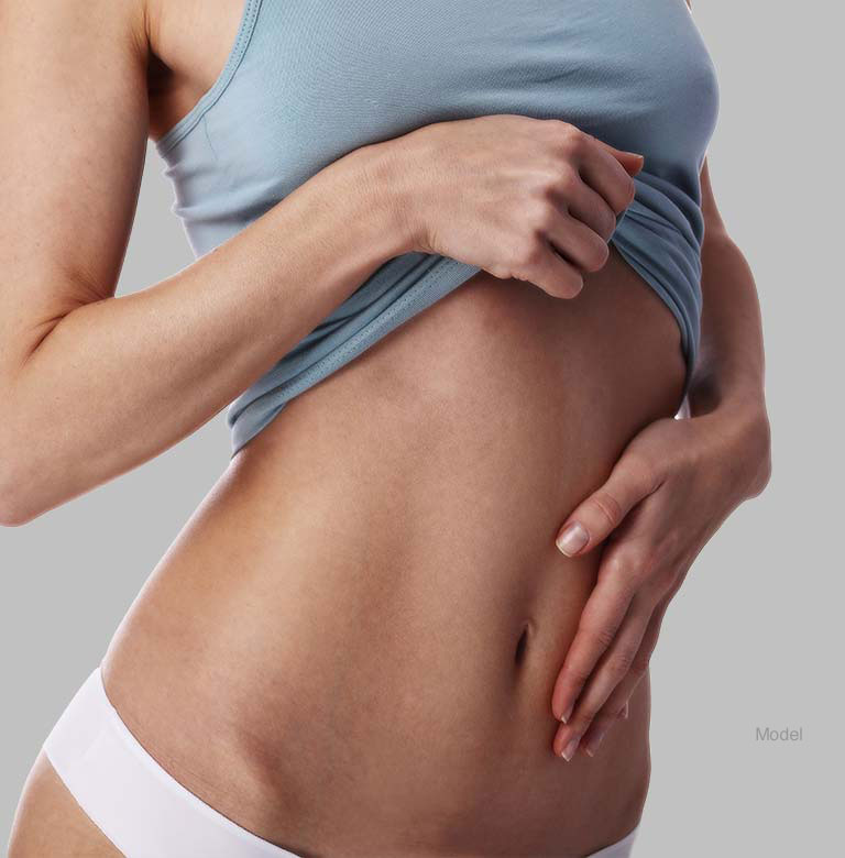 Woman Touching flat tummy